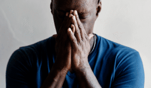Man puts head in hands, wondering what GAD is