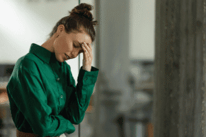 Woman sighs as she struggles with harm OCD