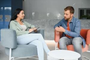 Person talks to therapist about how to help someone with paranoid schizophrenia